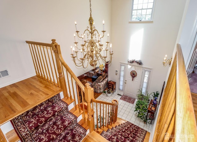 89 King St, Edison, NJ 08820 - entrance foyer featuring a chandelier, a high ceiling, and wood finished floors