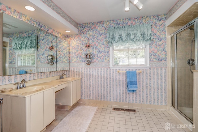 89 King St, Edison, NJ 08820 - bathroom featuring wallpapered walls, tile patterned flooring, a stall shower, double vanity, and recessed lighting