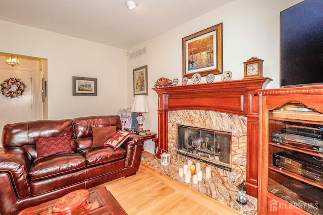 89 King St, Edison, NJ 08820 - living area featuring wood finished floors and a fireplace