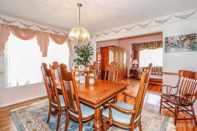89 King St, Edison, NJ 08820 - dining area with a chandelier, plenty of natural light, and wood finished floors