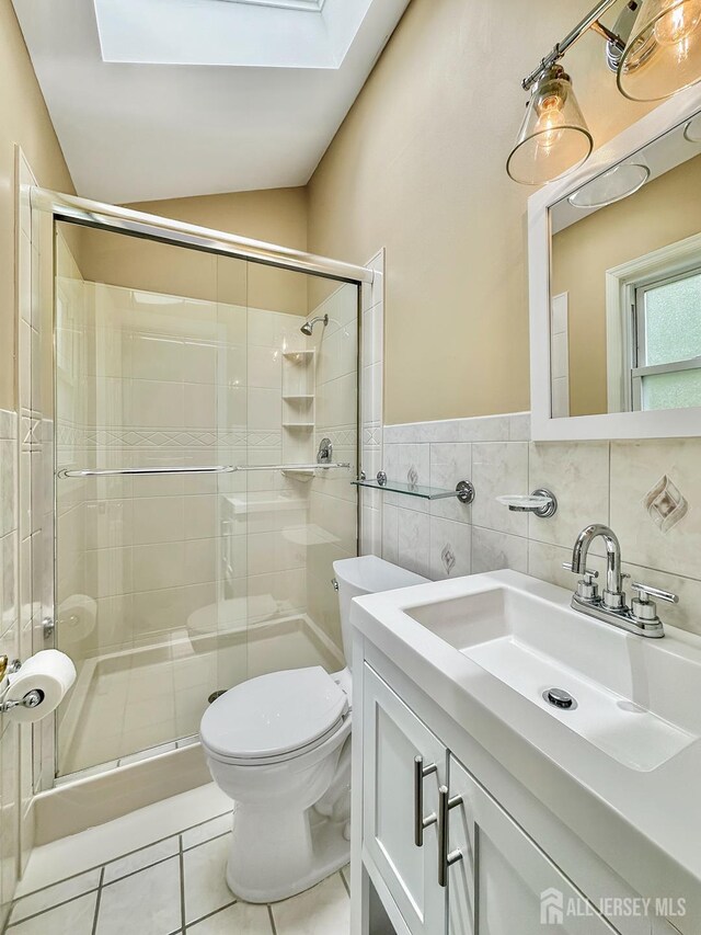 12 Dana Estates Dr, Old Bridge, NJ 08859 - bathroom featuring toilet, a skylight, tile patterned floors, a stall shower, and vanity