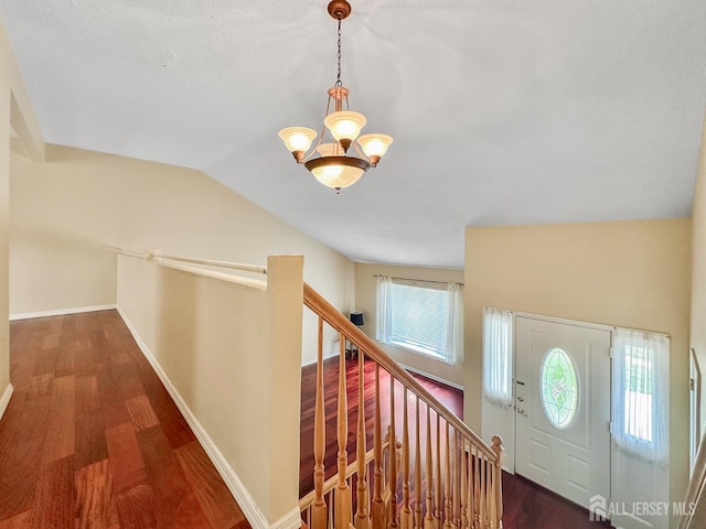 12 Dana Estates Dr, Old Bridge, NJ 08859 - entrance foyer with a chandelier, wood finished floors, vaulted ceiling, and baseboards