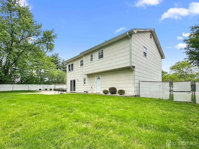 12 Dana Estates Dr, Old Bridge, NJ 08859 - rear view of property with a gate and a patio area