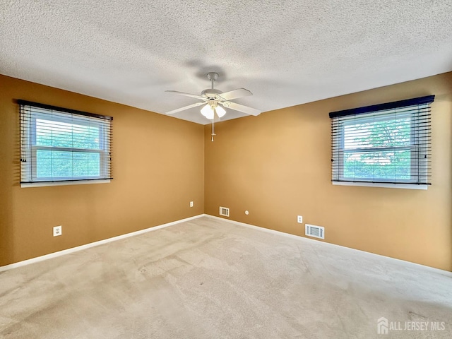 12 Dana Estates Dr, Old Bridge, NJ 08859 - unfurnished room featuring a ceiling fan, plenty of natural light, carpet flooring, a textured ceiling, and baseboards