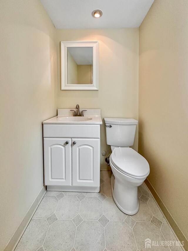 12 Dana Estates Dr, Old Bridge, NJ 08859 - half bathroom featuring toilet, vanity, tile patterned flooring, baseboards, and recessed lighting