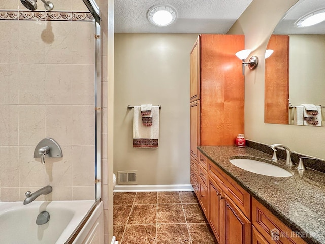 12 Dana Estates Dr, Old Bridge, NJ 08859 - full bathroom featuring vanity, shower / bathtub combination, a textured ceiling, baseboards, and tile patterned flooring