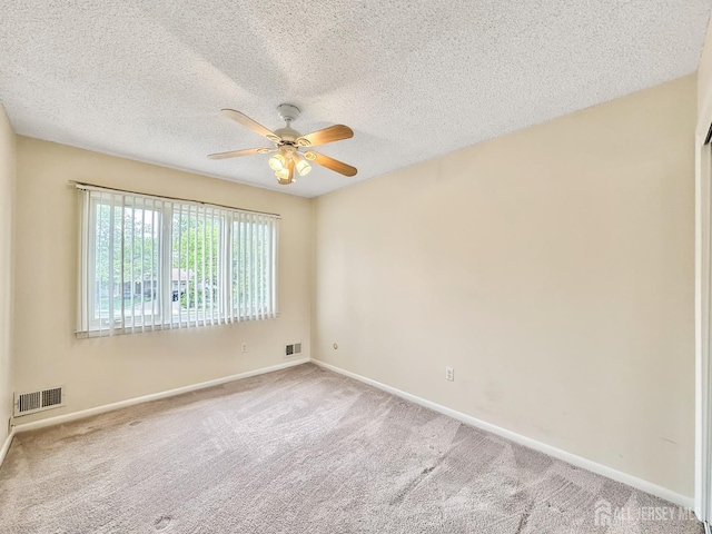 12 Dana Estates Dr, Old Bridge, NJ 08859 - carpeted spare room featuring ceiling fan, a textured ceiling, and baseboards