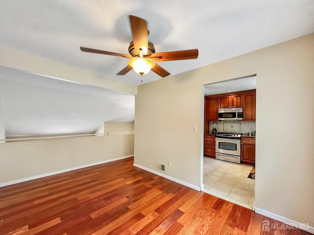 12 Dana Estates Dr, Old Bridge, NJ 08859 - unfurnished room featuring a ceiling fan, light wood-type flooring, and baseboards
