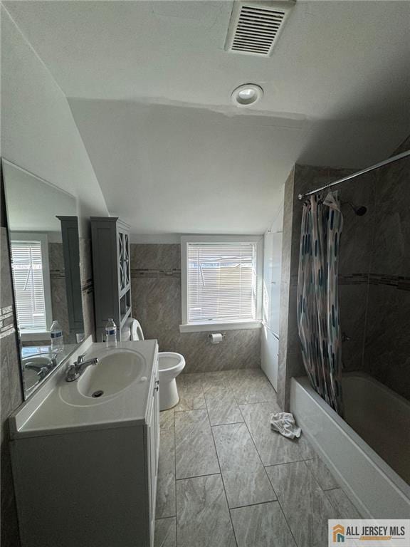 full bath featuring visible vents, vaulted ceiling, vanity, and toilet