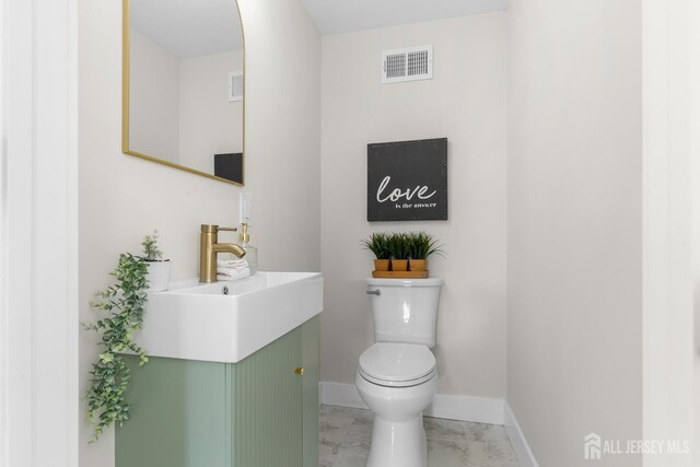 251 Church St, South Amboy, NJ 08879 - half bathroom featuring vanity and marble look tile flooring