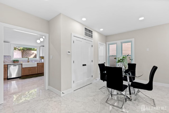 251 Church St, South Amboy, NJ 08879 - dining area featuring light marble finish flooring and recessed lighting