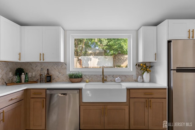 251 Church St, South Amboy, NJ 08879 - kitchen featuring appliances with stainless steel finishes, light countertops, tasteful backsplash, and white cabinets