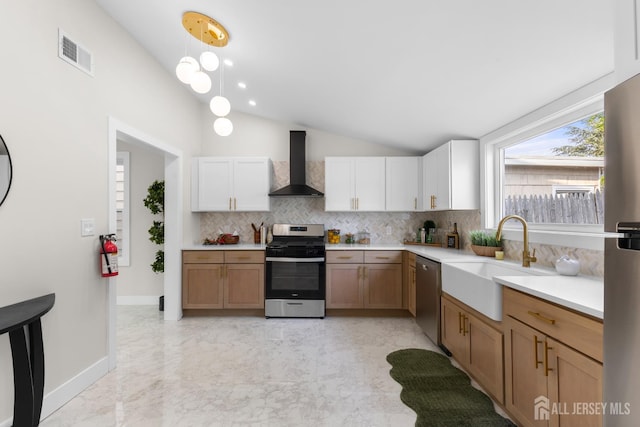 251 Church St, South Amboy, NJ 08879 - kitchen featuring wall chimney range hood, stainless steel appliances, backsplash, vaulted ceiling, and light countertops