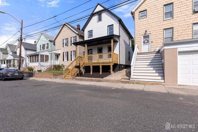 251 Church St, South Amboy, NJ 08879 - view of front of home featuring stairs, a residential view, and covered porch