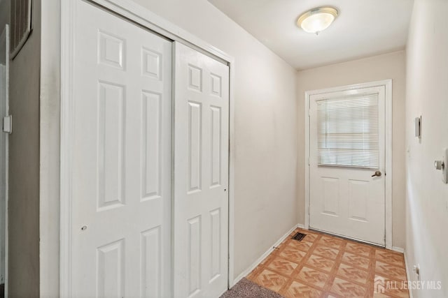 153 Concordia Cir Unit D, Monroe, NJ 08831 - doorway with baseboards and light flooring