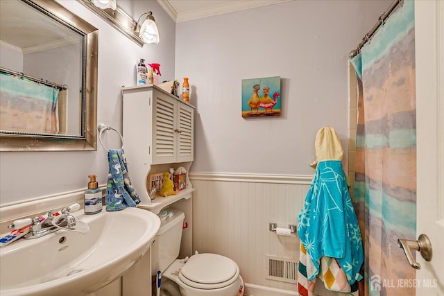 325 Mcdowell Dr, East Brunswick, NJ 08816 - full bathroom with crown molding, a wainscoted wall, and a shower with curtain