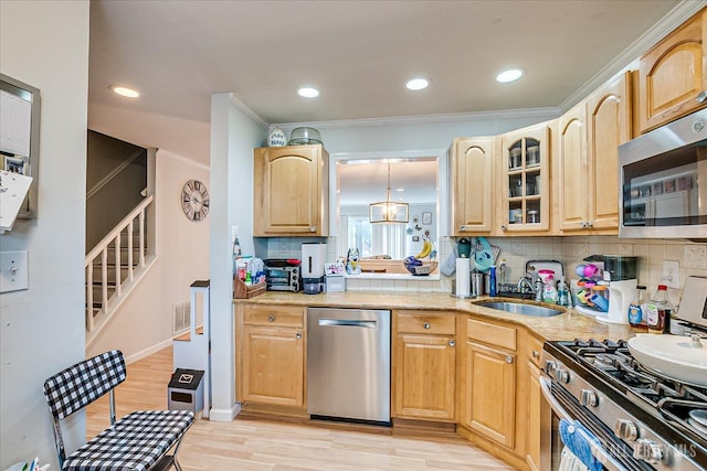 325 Mcdowell Dr, East Brunswick, NJ 08816 - kitchen with appliances with stainless steel finishes, glass insert cabinets, light wood-style flooring, crown molding, and light brown cabinets