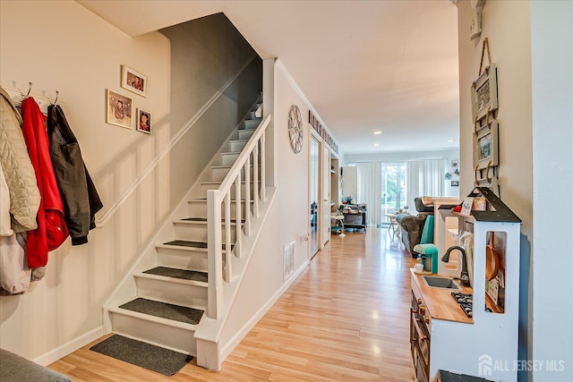 325 Mcdowell Dr, East Brunswick, NJ 08816 - staircase with wood finished floors and recessed lighting