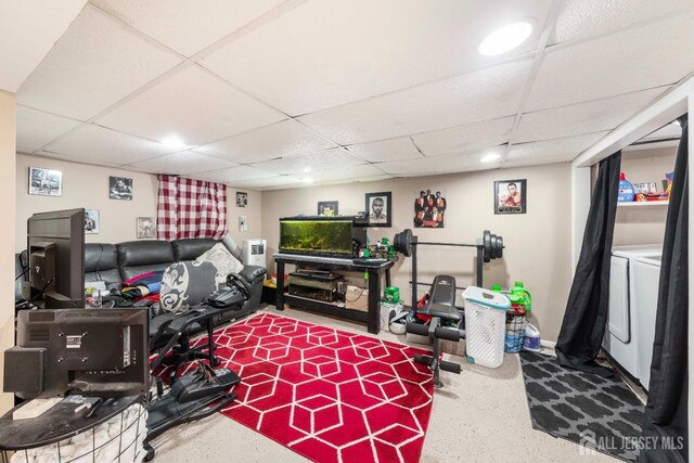 living area featuring a paneled ceiling