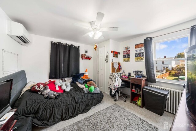 bedroom featuring ceiling fan, a wall mounted AC, light colored carpet, and radiator