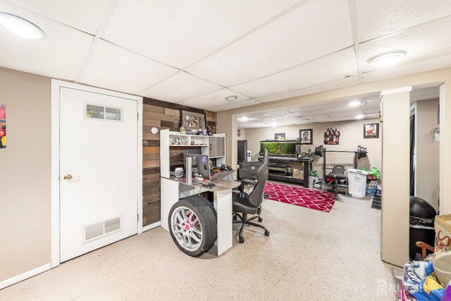 home office with a paneled ceiling and visible vents