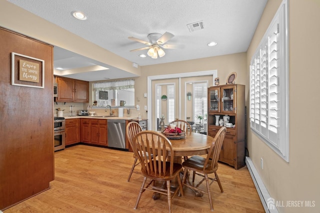 339 Quinton Dr Unit 339C, Monroe, NJ 08831 - dining room with a ceiling fan, baseboard heating, light wood finished floors, a textured ceiling, and recessed lighting