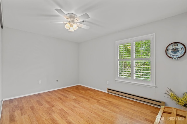 339 Quinton Dr Unit 339C, Monroe, NJ 08831 - unfurnished room featuring a baseboard radiator, wood finished floors, a ceiling fan, and baseboards