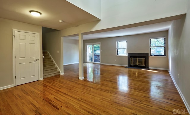 unfurnished living room featuring hardwood / wood-style floors