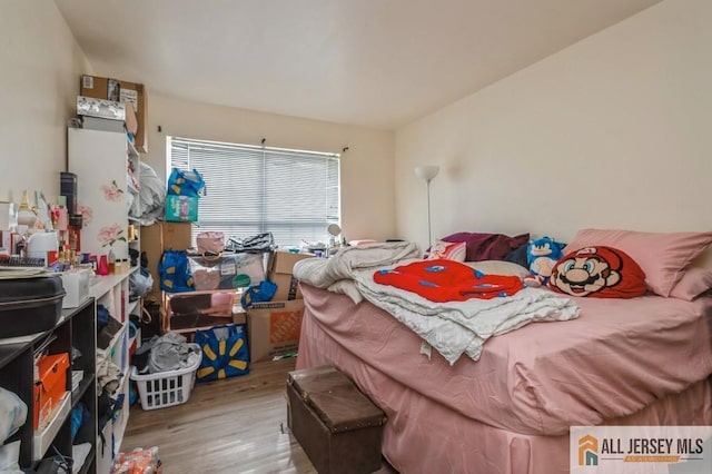 bedroom with wood finished floors