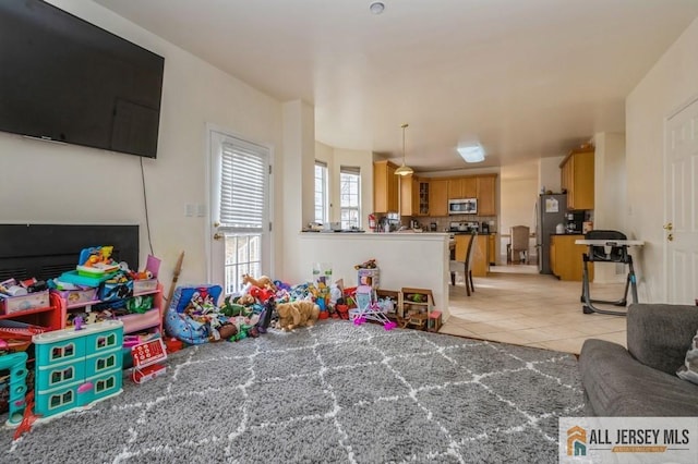 recreation room featuring light tile patterned flooring