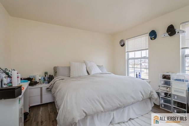 bedroom with wood finished floors