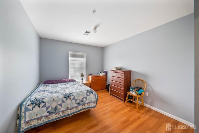 bedroom featuring hardwood / wood-style flooring