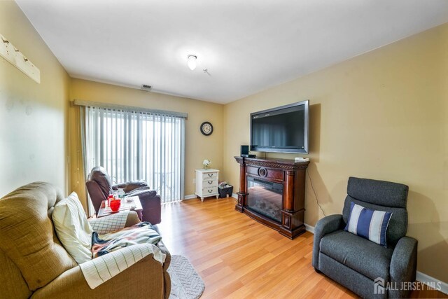 living room with light hardwood / wood-style floors