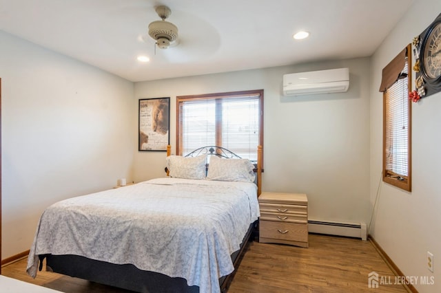 40 Riverview Ave, Piscataway, NJ 08854 - bedroom featuring a wall mounted AC, a baseboard radiator, wood finished floors, recessed lighting, and ceiling fan