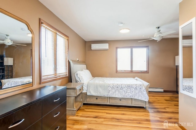 40 Riverview Ave, Piscataway, NJ 08854 - bedroom featuring a wall unit AC, baseboard heating, light wood-style flooring, and baseboards