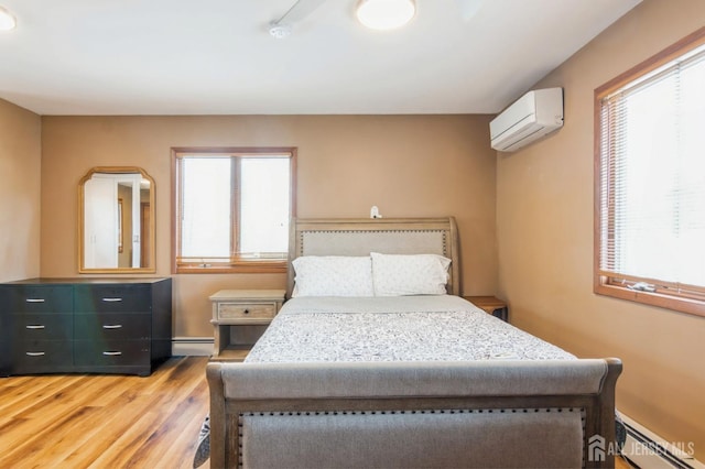 40 Riverview Ave, Piscataway, NJ 08854 - bedroom with baseboard heating, an AC wall unit, multiple windows, and light wood-style floors