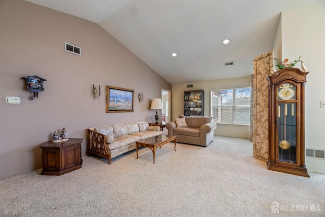 carpeted living room featuring lofted ceiling, visible vents, and recessed lighting