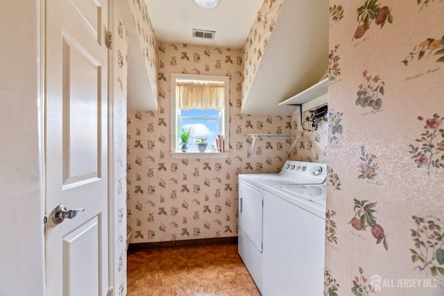 washroom with independent washer and dryer, laundry area, visible vents, and wallpapered walls