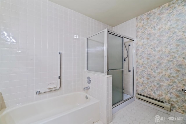 full bathroom with a stall shower, tile patterned flooring, a bath, and a baseboard heating unit