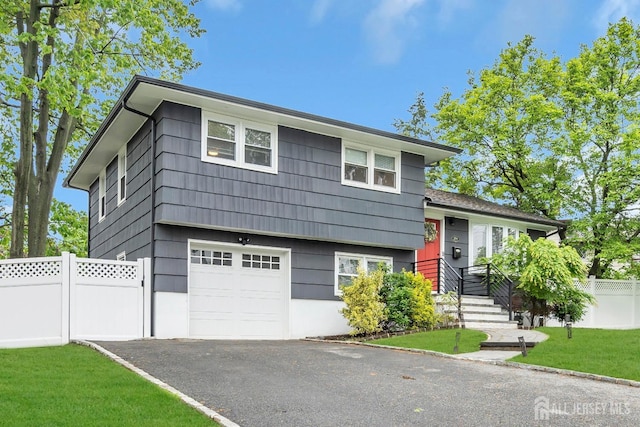 374 Nottingham Way, Union Twp, NJ 07083 - split level home with an attached garage and asphalt driveway