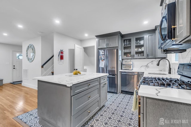 374 Nottingham Way, Union Twp, NJ 07083 - kitchen with stainless steel appliances, gray cabinetry, a sink, recessed lighting, and a center island