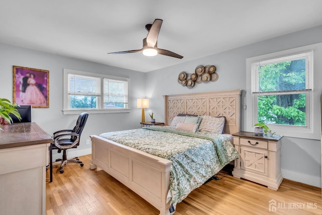 374 Nottingham Way, Union Twp, NJ 07083 - bedroom featuring multiple windows, light wood-style flooring, baseboards, and an office area