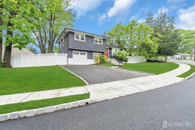 374 Nottingham Way, Union Twp, NJ 07083 - tri-level home featuring asphalt driveway and an attached garage