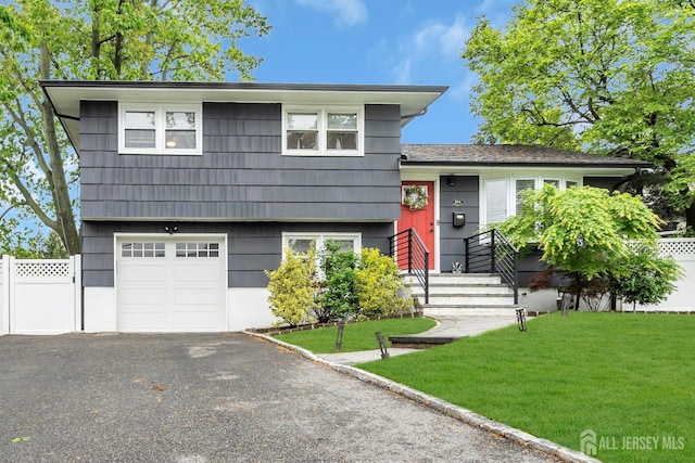 374 Nottingham Way, Union Twp, NJ 07083 - tri-level home with an attached garage and asphalt driveway