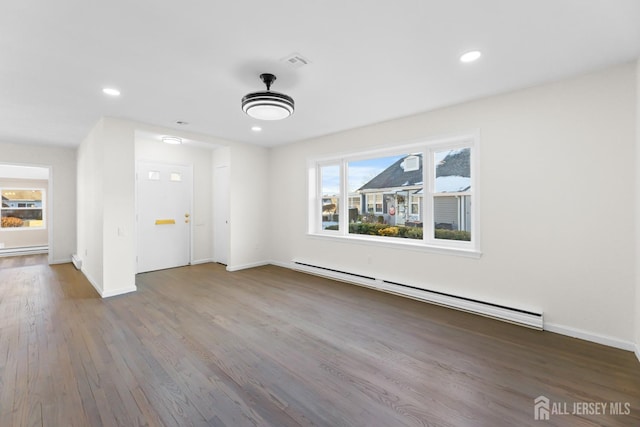 interior space with a baseboard radiator and wood-type flooring