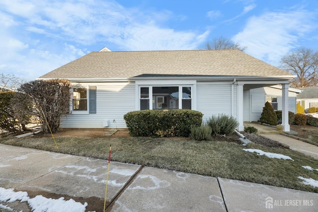 view of front of home featuring a shingled roof