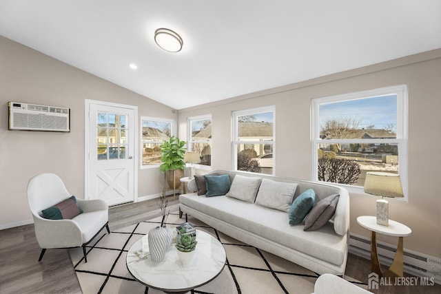 living room featuring lofted ceiling, light hardwood / wood-style flooring, a baseboard radiator, and a wall mounted AC