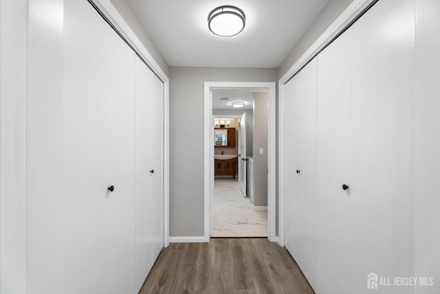 hallway featuring light wood-type flooring