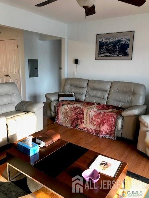 69 Liddle Ave, Edison, NJ 08837 - living room featuring wood finished floors, electric panel, and ceiling fan