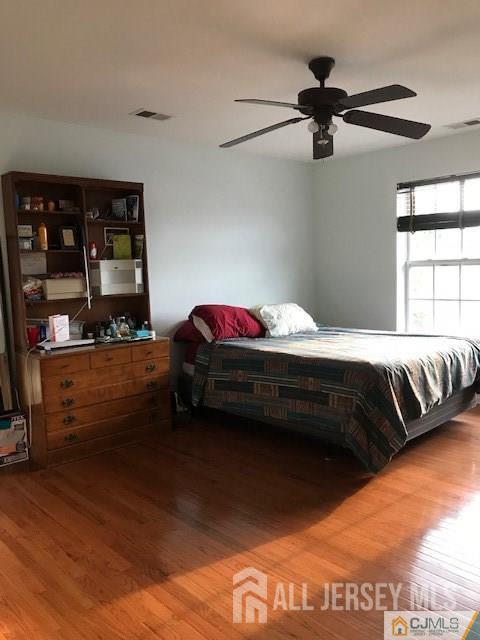 69 Liddle Ave, Edison, NJ 08837 - bedroom with wood finished floors and ceiling fan